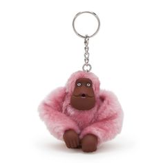 a keychain with a small monkey on it's back and eyes open