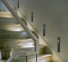 the stairs are made of wood and have metal handrails