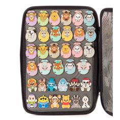 an open case filled with lots of different cartoon character magnets on the inside of it