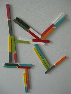 several popsicles are arranged in the shape of letters k and f on a white surface