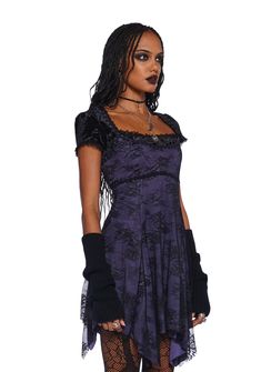 This mini dress has a stretchy knit construction with a floral lace overlay, floral fabric lace trim, a handkerchief hem, and adjustable shoulder straps. Purple Long Dress, Lace Handkerchief, Purple Mini Dresses, Handkerchief Hem, Dress Lace, Lace Overlay, Floral Fabric, Dolls Kill, Gothic Fashion