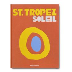 a book with an orange cover and blue circle on the front, which reads st tropez solei