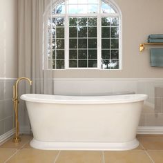 a white bath tub sitting next to a window