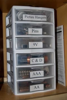 the drawers are labeled with pictures and pins