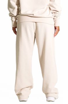 These high-rise elastic-waist sweatpants made from comfy cotton-blend fleece are ones you'll reach for each time lounge day comes around. 33" length (size Small) Elastic waist Side-seam pockets 80% cotton, 20% polyester Hand wash, line dry Imported Comfortable Sweats With Elastic Cuffs For Loungewear, Relaxed Sweats For Loungewear, Relaxed Solid Color Sweats For Loungewear, Solid Color Relaxed Sweats For Loungewear, Relaxed Fit Cotton Sweats For Relaxation, Loungewear Sweatpants With Comfort Waistband, Cozy Relaxed Fit Sweatpants For Loungewear, Oversized Comfortable Joggers For Leisure, Cozy Sweatpants With Comfort Waistband For Loungewear