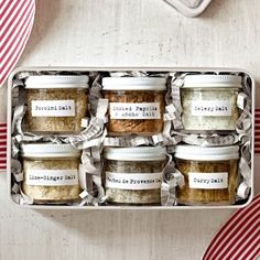 a box filled with lots of different types of spices and seasoning pastes on top of each other