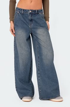 Low-slung, nonstretch jeans are crafted with puddling hems and turned to the perfect faded indigo wash. Zip fly with button closure Five-pocket style 100% cotton Machine wash, dry flat Imported Women Mom Jeans, Straight Leg Baggy Jeans, Womens Boyfriend Jeans, Baggy Wide Leg Jeans, Pants Streetwear, Boyfriend Denim, Thrift Inspo, Jeans Wide, Outfit Jeans