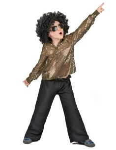 a young boy dressed in disco clothes and sunglasses pointing at something with his hand up