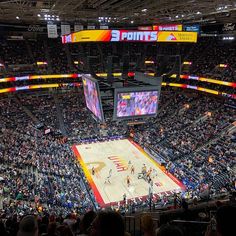 a basketball game is being played in an arena