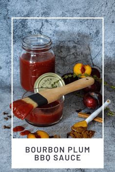 bourbon plum bbq sauce in a glass jar with a wooden spoon next to it