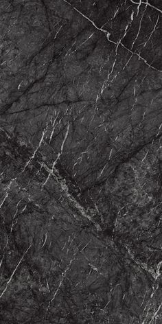 black marble textured with white vein lines