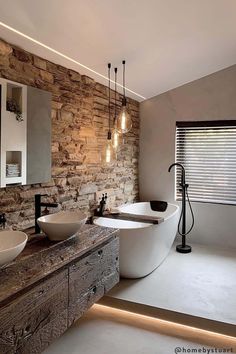 a bathroom with two sinks and a large tub