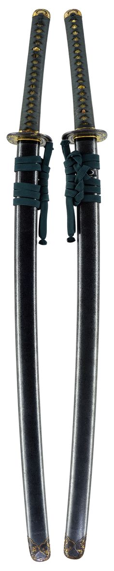 two black swords with gold accents on each end and green cords attached to the ends