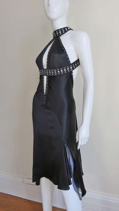 For Sale on 1stdibs - A fabulous black silk dress from Versace the subject of a 2004 ad campaign. It has square silver prong set studs along the straps which wrap around the Metal Head Fashion, Insane Fashion, Backless Silk Dress, Gianni Versace Dress, Country Vibes, Culture Fashion, Black Linen Dress, Black Clothes, Black Silk Dress