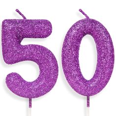 purple glitter number 50 cake topper on a stick