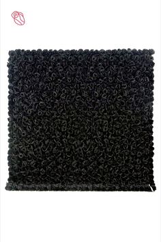 the black rug is made out of foam and has been placed on top of a white surface