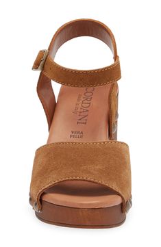 A clog-inspired, woodgrain platform grounds this Italian-made quarter-strap sandal crafted from soft leather and trimmed with antiqued studs. 3" heel; 1" platform Cushioned footbed Leather upper and lining/synthetic sole Made in Italy Suede Sandals With Wooden Wedge Heel, Brown Cork Sandals With Leather Sole, Comfortable Brown Platform Sandals, Cork Platform Sandals With Round Toe, Summer Cork Platform Sandals, Brown Cork Platform Wedge Sandals, Leather Platform Sandals, 70s Inspired, Brown Sandals