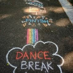 chalk writing on the ground in front of a sidewalk that has been painted with words dance break