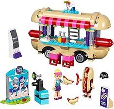 a toy food truck with hot dogs and other toys