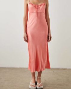 Just add slides or mules and you are good to go. The Laramie Dress is a sensual, party-ready silhouette designed with delicate, spaghetti straps and an adjustable drawcord at the neckline. Taking an elegant, minimalist approach, the coral color makes a subtle statement. Best of all, its done in a smooth, satin back crepe that looks as luxe as it feels. 55% Rayon 45% Viscose. A must-have! Round out your vacation and weekend wardrobe with this plus size dress Rails Laramie Dress in Coral | Coral | Dresses | Materials & Care Instructions: ['55% Rayon, 45% Viscose', 'Imported'] Coral Cocktail Dress, Dresses Materials, Coral Maxi Dresses, The Coral, Ruched Midi Dress, Coral Dress, Satin Midi Dress, Coral Color, Silhouette Design