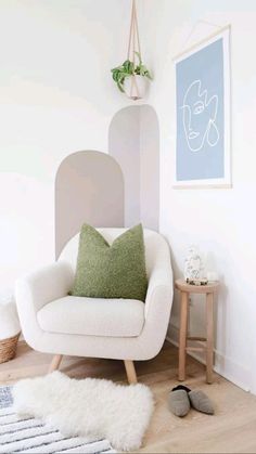 a white chair sitting in a living room next to a window