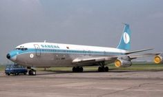 an airplane sitting on the tarmac at an airport