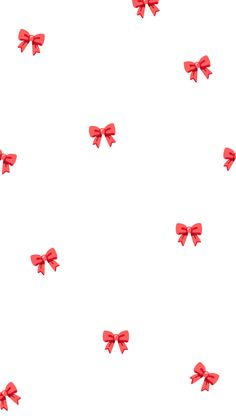 several red bows are flying in the air on a white background that looks like they have been tied together