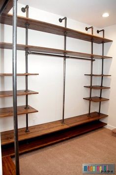 an empty room with shelving unit in the corner