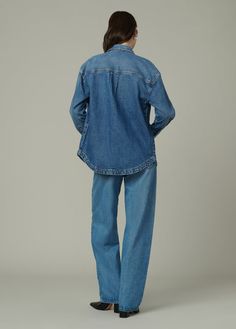 An oversized shirt jacket with drop shoulder. DETAILS + FIT Relaxed, oversized fit Hidden snap front closure Functional chest flap pockets Back yoke & action pleat Wide shirttail hem This style runs small, size up for a better fit. Lightweight rigid indigo denim that is perfect for tailoring. WASH: Wait A Minute is a classic, mid-vintage wash. 99.5% COTTON, 0.5% SPANDEX Moa is 5’10” and is wearing a size SmallWaist: 25” Bust: 33” Hips: 35.5” Corduroy Top, Wait A Minute, Long Sleeve Denim Shirt, Indigo Denim, Men Fits, Petite Maternity, Maternity Tops, Oversized Shirt, Classic Shirt