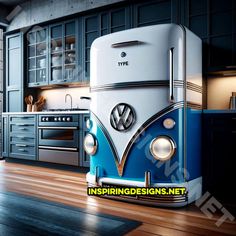 a vw bus fridge in the middle of a kitchen with blue cabinets and wood floors