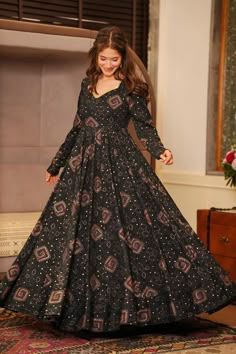 Adorn your aura with the magnificence of this Rayon Fabric Readymade Anarkali Gown. Imprinted with beautiful prints on Reach Color, it gives a stylish ethnic touch to your look. Paired with an equally gorgeous Dupatta, it elevates the fashion game. Ensure the outfit's longevity with easy Dry Clean only instruction. Glamorize any event with this charismatic outfit. Frock Models Party Wear, Long Frocks Designs For Women Party Wear, New Design Anarkali Dress, Gowns Made From Saree, Gown Models For Women, Long Traditional Dresses, Rayon Dress Design, Charismatic Outfit, Ethnic Gown Designs