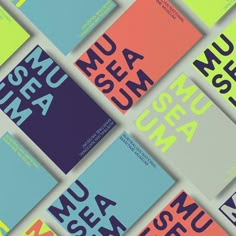 several different types of books with the words museum on them, all in bright colors