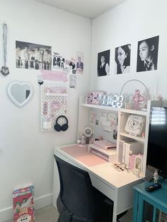 a room with a desk and pictures on the wall