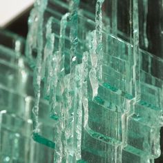 some very pretty green glass blocks together