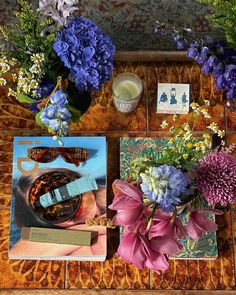 there are flowers and cards on the table