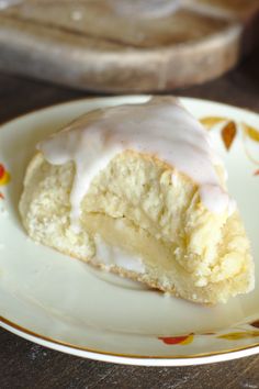 a piece of cake with icing on a plate