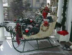 an old fashioned sleigh decorated with christmas decorations