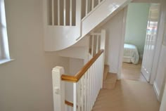 the stairs in this house are made of wood and white