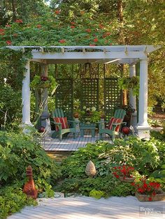 a gazebo surrounded by lots of plants and flowers