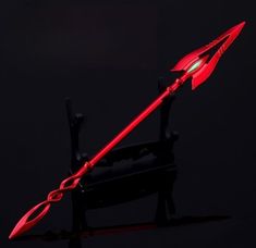 a red arrow shaped object on a black background