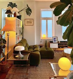 a living room filled with furniture and lots of plants