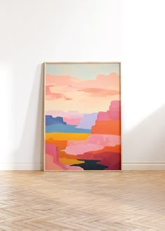 a painting hanging on the wall in an empty room