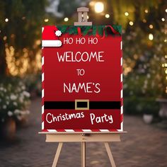 a welcome sign for a christmas party with santa's hat on it and lights in the background