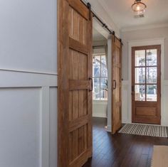 4-Panel Sliding Barn Door in Entryway 4 Panel Door, Esthetician Room, Pine Doors, Interior Sliding Barn Doors, Rustic Luxe, College Apartment, Kitchen Doors, Entry Way, Wood Doors Interior