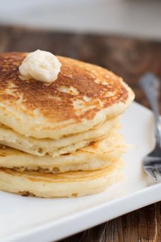 a stack of pancakes with butter on top