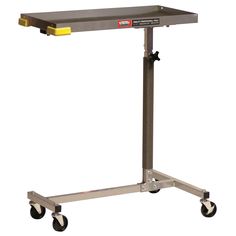 a metal table on wheels with a yellow handle