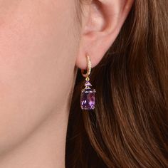 These earrings feature long cushion-cut amethysts, set in 14K yellow gold that is adorned with openwork filigree. Diamonds adorn the tops of the earrings. The amethysts have a total carat weight of 6.50 carats and the diamonds have a total weight of 0.07 carats.
Additional photos of these earrings are available upon request.
If you have any questions about the Fulton Earrings, please feel free to contact us. Estate Diamond Jewelry, Elongated Cushion Cut, Amethyst Gold, Amethyst Earrings, Purple Wedding, Cushion Cut, Diamond Jewelry, Gold Earrings, Amethyst