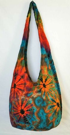 a multicolored bag hanging on a white wall