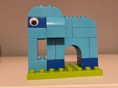 an elephant made out of legos sitting on a table