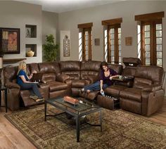 two women sitting on couches in a living room